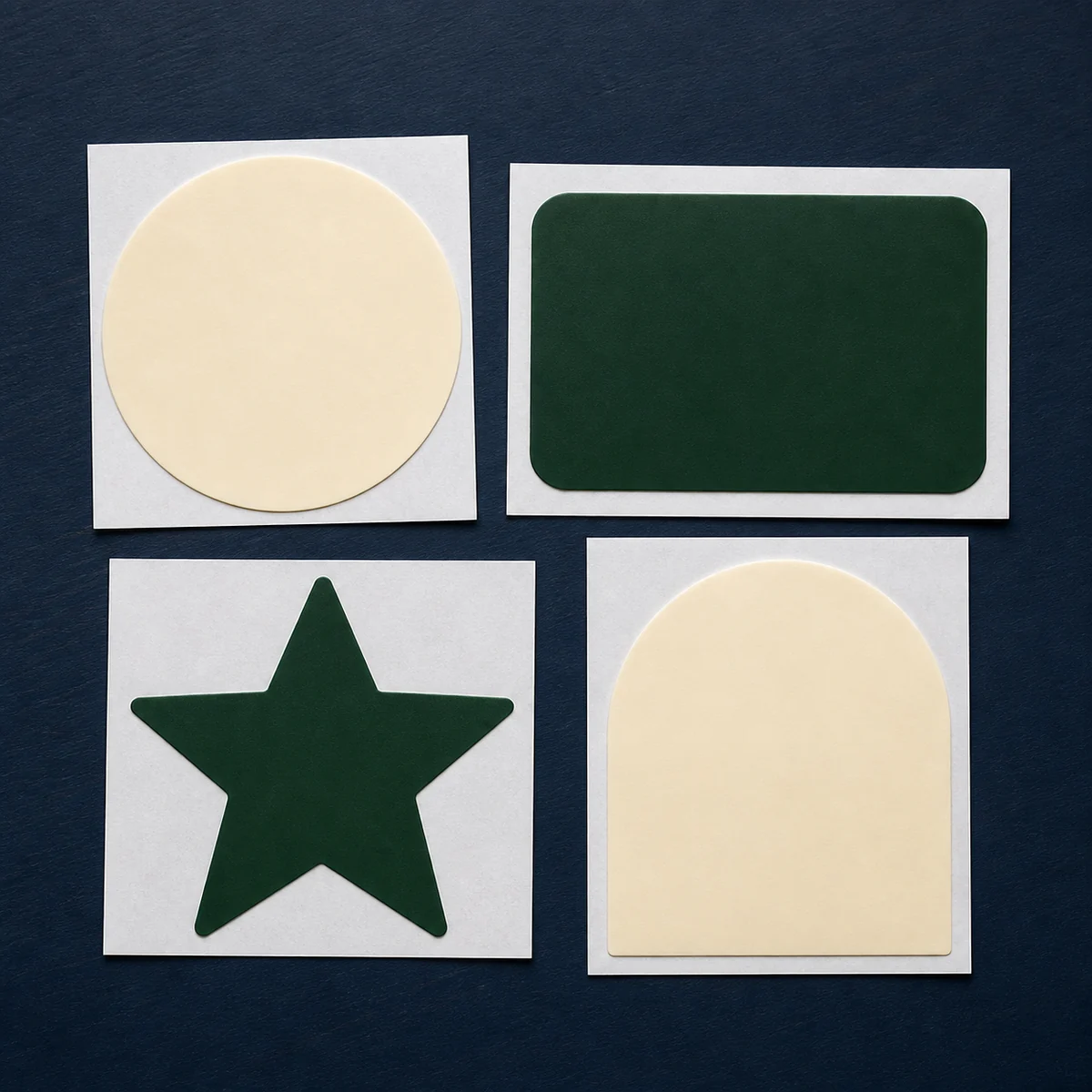 Blank cream and forest-green vinyl decal shapes